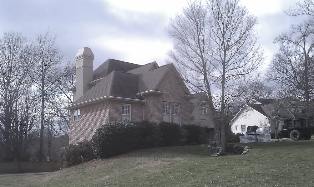 Completed dark shingle roof on an East Tennessee brick home