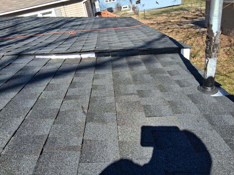 Beautifully installed charcoal shingles by Crockett Construction