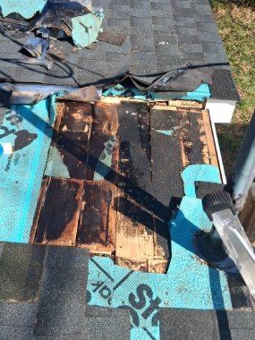 Rotted roof decking exposed during a tear-off in East Tennessee