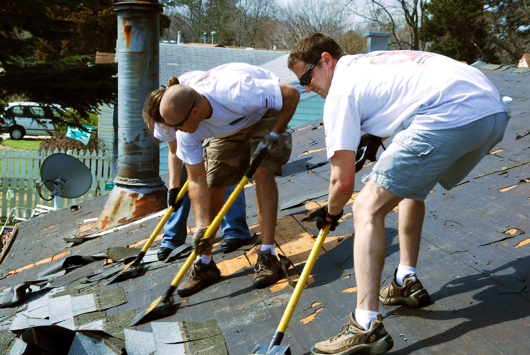 Crew removing old roof before replacement